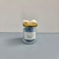 Two Luxe 34 Home geranium wax melt jars showing front and back labels with gold lids`