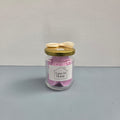 Luxe 34 Home rose wax melts in glass jar with pink wax melts, gold lid and cream ribbon bow