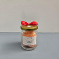 Luxe 34 Home sweet orange wax melts in glass jar with orange wax melts, gold lid and red ribbon bow
