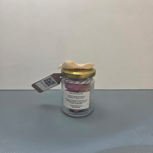 Reverse side of Cherry and Vanilla wax melts jar showing ingredients label