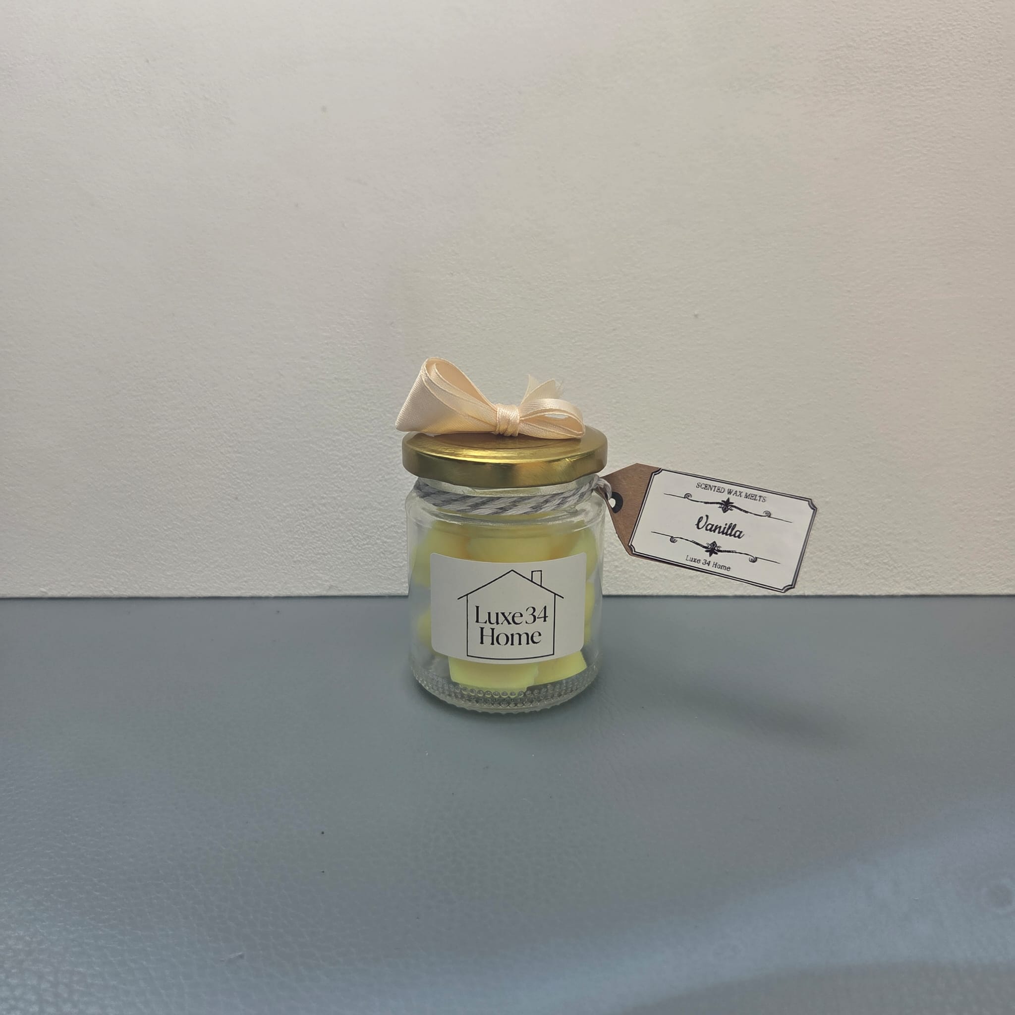 Vanilla wax melts in glass jar with gold lid, cream ribbon bow and Vanilla hang tag, Luxe34 Home label